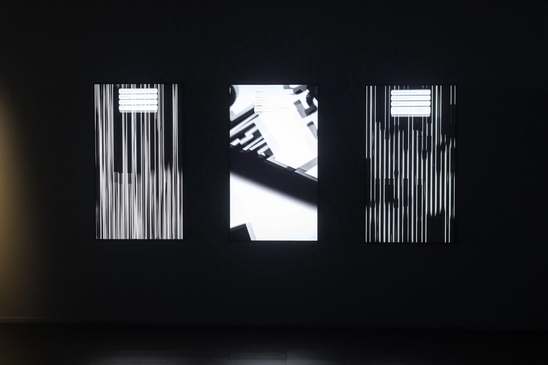 Banpo-Xism: three vertical screens showing transformed apartment coordinates and text. Artwork by Jeanyoon Choi.