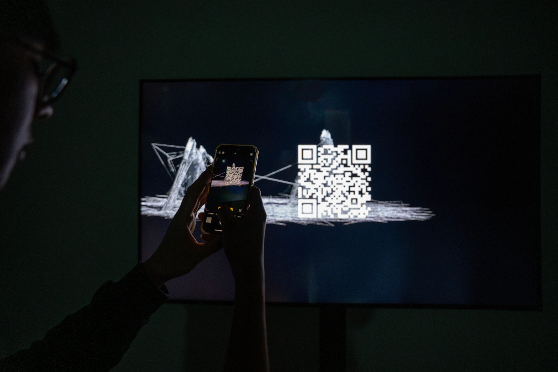 SoTA: visitor using a phone to scan the installation QR code. Artwork by Jeanyoon Choi, Euan Kang, SeJoon Park, Minhyeok Seo, Prof. Yiyun Kang.